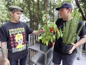 Celebrity chefs Chuck Hughes, right, and Danny Smiles talk about the herbs and peppers they'll be planting onsite as they get things ready for their weekends catering music festivals at Parc Jean Drapeau.