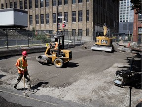 A skeleton crew was at work on Overdale Ave. near Lucien-L’Allier St. on Friday, where a vacant lot is being converted to luxury townhouses.