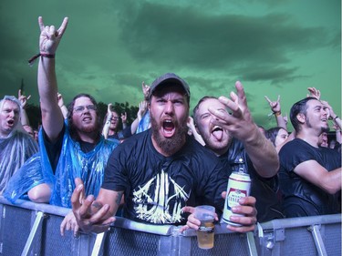 The crowd cheers for Emperor as rain delays the performance at the Heavy Montreal Festival on July 28, 2018.