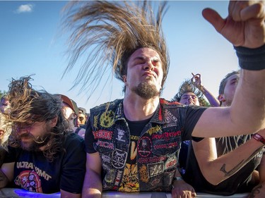 Fans of Trivium bounce to the music at the Heavy Montreal Festival on Sunday, July 29, 2018.