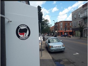 Members of Montréal Antifasciste roamed Ontario St. Sunday removing stickers from the extreme right-wing group Atalante Québec and replacing them with their own.