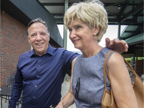 CAQ leader François Legault with his wife Isabelle Brais after he met and spoke to west islanders at the  Marche de L'Ouest in Dollard des Ormeaux, on Saturday, July 28, 2018.