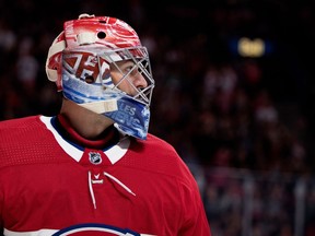 Canadiens goalie Carey Price takes break during stoppage in play of NHL exhibition game against the New Jersey Devils at the Bell Centre in Montreal on Sept. 21, 2017.