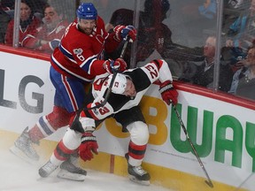 Montreal Canadiens' Shea Weber (6) lifts his stick on New Jersey Devils' Stefan Noesen (23), during first period NHL action in Montreal on Thursday December 14, 2017.