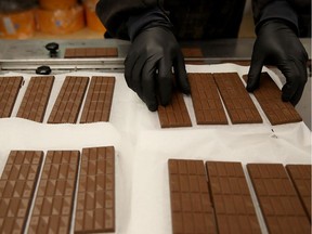 A worker in California prepares to package freshly made marijuana-infused chocolate bars. Last week, a four-year-old girl in Nova Scotia was hospitalized and released after eating 15 squares of a chocolate bar infused with marijuana.