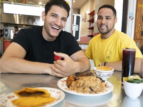 Julien Chemtov, left, and Nathanial Tull with Caribbean dishes. Not surprisingly, this is neither Nathanial Tull nor Chemtov’s first gig at Lloydies.