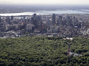 The city of Montreal skyline is seen over the top of Mount Royal in this aerial view on Thursday, July 19, 2018.