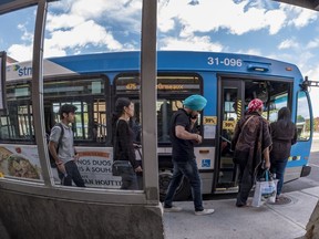 Montrealers line up for the 475 at the Cote-Vertu metro station in Montreal.