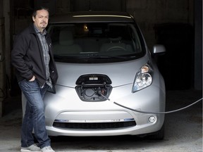 “I feel like I’m doing my part,” says George Giannelis, owner of an all-electric Nissan Leaf. It costs him about $1 a day to charge his car.