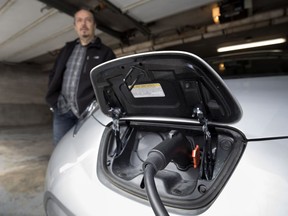 Georges Giannelis is the proud owner of a 2015 Nissan Leaf all-electric car in Montreal on Wednesday April 25, 2018.