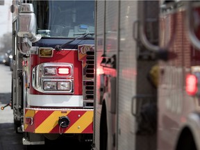 MONTREAL, QUE.: APRIL 24, 2018-- A row of fire trucks wait after a false alarm in Little Burgundy in Montreal on Tuesday April 24, 2018. (Allen McInnis / MONTREAL GAZETTE) ORG XMIT: 60537