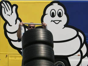 Michelin wheels are rolled out at a Grand Prix in Indianapolis.