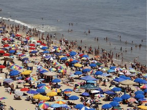 Umbrellas dot a Maryland beach. "I hope that people avoid deliberately tanning as an activity and use protection methods like sunscreen or seeking out shade to minimize their UV exposure," Christopher Labos writes.
