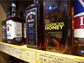 In this Saturday, July 7, 2018, file photo, whiskeys distilled and bottled in the U.S. are displayed for sale in a grocery store in Beijing.