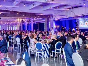 Lights twinkle overhead as 500-plus high-profile guests assemble at Alexandra Pier for the Canadian Red Cross fundraising event.