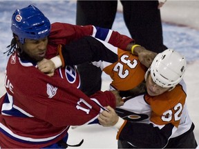 The Canadiens’ Georges Laraque and the Philadelphia Flyers' Riley Cote fight during NHL game at the Bell Centre in Montreal on Dec. 7, 2009.