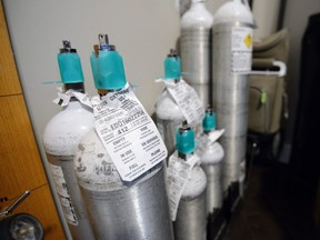 Oxygen tanks for an NICUs oxygen machine sits in home of Marissa German and Michael German in Calgary, AB., on Monday, April 4, 2016. (Andy Maxwell Mawji/ Postmedia)