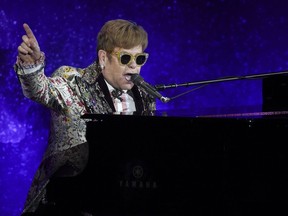 Singer Elton John performs before announcing final world tour at Gotham Hall on Wednesday, Jan. 24, 2018, in New York. In June, he called upon his fans to boycott social media over homophobic hate speech online.