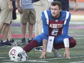 Montreal Alouettes quarterback Johnny Manziel stretches during the warm-up prior to a CFL football game against the Edmonton Eskimos in Montreal on July 26, 2018.