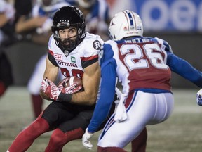 Ottawa Redblacks receiver Brad Sinopoli tries to get past Montreal Alouettes defensive-back Tyree Hollins during first quarter action on Aug. 31, 2017 in Montreal.
