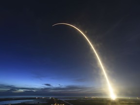 A SpaceX Falcon 9 rocket launches just before dawn Friday, June 29, 2018 at Launch Complex 40 at Cape Canaveral, Fla. The used Falcon rocket blasted off before dawn, hauling nearly 6,000 pounds (2,700 kilograms) of cargo, including the spherical AI bot named Cimon; genetically identical mice, or mousetronauts; and super-caffeinated coffee for the crew of the International Space Station. The shipment, packed into a Dragon capsule that's also recycled, should reach the station Monday.