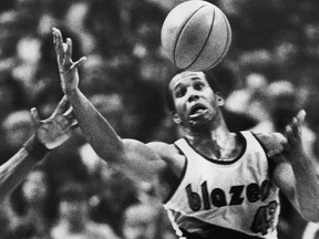 Portland Trail Blazers' Kermit Washington gains control of a loose ball during an NBA basketball game in Portland, Ore. on Dec. 25, 1979. (AP Photo/Jack Smith)