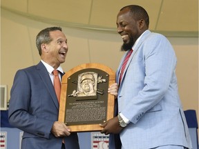 Hall of Fame President Jeff Idelson, left, poses with Vladimir Guerrero during an induction ceremony at the Clark Sports Center on Sunday, July 29, 2018, in Cooperstown, N.Y.