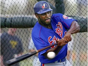 Vladimir Guerrero takes his cuts in the batting cage during Expos' spring training camp in Melbourne, Fla., in 2003.