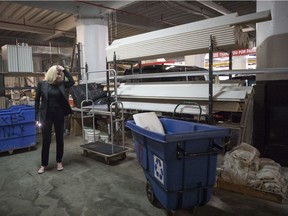 In this Thursday, June 28, 2018 photo, Sabine Anton looks over construction materials stored in the garage of 184 Kent Avenue in the Brooklyn borough of New York in the building owned by Kushner Cos.