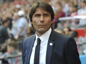 FILE - In this Saturday, May 19, 2018 file photo, Chelsea manager Antonio Conte looks on during their English FA Cup final soccer match against Manchester United at Wembley stadium in London, England. Chelsea has fired manager Antonio Conte after a two-year tenure in which he won the English Premier League and FA Cup. The London club said on Friday, July 13, "We wish Antonio every success in his future career."