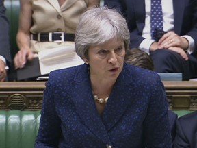 In this image from TV, Britain's Prime Minister Theresa May gives statement in the parliament Monday July 9, 2018. British Foreign Secretary Boris Johnson resigned Monday, adding to divisions over Brexit that threaten to tear apart Prime Minister Theresa May's government.