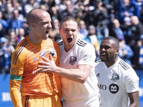 Montreal Impact goalkeeper Evan Bush celebrates with teammates Samuel Piette, centre, and Chris Duvall after stopping an Los Angeles FC penalty kick on April 21, 2018, in Montreal. Piette and Duval said on Friday they will be cheering for Croatia, which faces France, in Sunday’s World Cup final.
