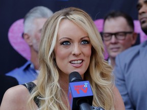 FILE - In this May 23, 2018 file photo, porn actress Stormy Daniels speaks during a ceremony for her receiving a City Proclamation and Key to the City in West Hollywood, Calif. Daniels was arrested at an Ohio strip club and is accused of letting patrons touch her in violation of a state law, her attorney said early Thursday, July 12. While Daniels was performing at Sirens, a strip club in Columbus, some patrons touched her in a "non-sexual" way, her lawyer, Michael Avenatti, told The Associated Press. An Ohio law known as the Community Defense Act prohibits anyone who isn't a family member to touch a nude or semi-nude dancer.