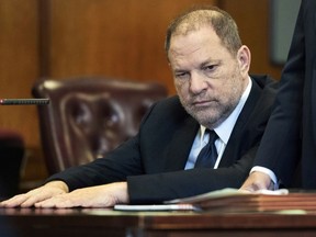 FILE - In this June 5, 2018 file photo, Harvey Weinstein appears in court in New York. Weinstein, who was previously indicted on charges involving two women, was due in court on Monday, July July 9 for arraignment on charges alleging he committed a sex crime against a third woman. An updated indictment unveiled last week alleges the movie mogul-turned-#MeToo villain performed a forcible sex act on a woman in 2006. The new charges include two counts of predatory sexual assault, which carries a maximum sentence of life in prison upon conviction.