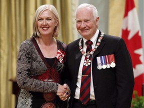 Governor General David Johnston invests Carmen Campagne as a Member of the Order of Canada during a ceremony at Rideau Hall Friday, Sept. 12, 2014 in Ottawa. Canadian singer-songwriter Campagne died of cancer at the age of 58, on July 4.