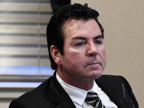 FILE - In this Wednesday, Oct. 18, 2017, file photo, Papa John's founder and CEO John Schnatter attends a meeting in Louisville, Ky. Schnatter is apologizing after reportedly using a racial slur during a conference call in May 2018. The apology Wednesday, July 11, 2018, comes after Forbes cited an anonymous source saying the pizza chain's marketing firm broke ties with the company afterward. (AP Photo/Timothy D. Easley, File)