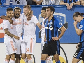 Atlanta United's Josef Martinez, second left, celebrates with teammates after scoring against the Montreal Impact during second half MLS soccer action in Montreal, Saturday, July 28, 2018.