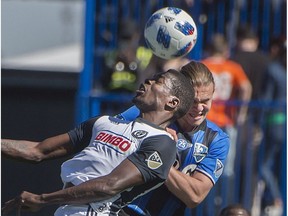 Impact's Samuel Piette, right, and Philadelphia Union's Cory Burke battle for the ball during MLS action in Montreal in May.