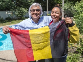 Belgian fan Robert Defays, and his daughter Audrey, show their colours at their home Monday, July 9, 2018 in Blainville, Quebec. Belgium will play France in the semi-finals at the World Cup of soccer.THE CANADIAN PRESS/Ryan Remiorz