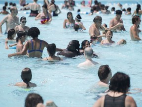 People cool down in a public pool in Montreal, Thursday, July 5, 2018.THE CANADIAN PRESS/Graham Hughes ORG XMIT: GMH106
