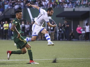 Montreal Impact's Matteo Mancosu (21) fires a shot against the Portland Timbers during an MLS soccer match Saturday, July 21, 2018, in Portland, Ore.
