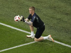 England goalkeeper Jordan Pickford warmups before the third place match between England and Belgium at the 2018 soccer World Cup in the St. Petersburg Stadium in St. Petersburg, Russia, Saturday, July 14, 2018.