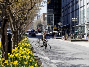 A cyclist crosses McGill College Ave. in Montreal May 8, 2018.