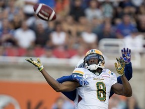 Alouettes defensive back Mitchell White stops Edmonton Eskimos wide receiver Kenny Stafford from completing the pass during CFL action at Molson Stadium in Montreal on July 26, 2018.