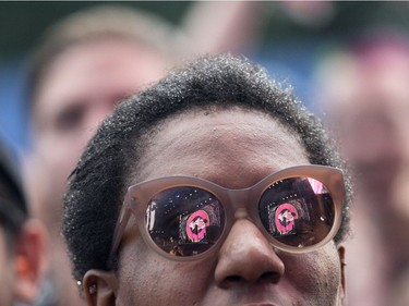 The Yeah Yeah Yeahs are reflected in a fan's glasses as they perform on Day 1 of the Osheaga festival in Montreal, August 3, 2018.