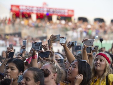 A crowd of kids with their phones during Post Malone at Osheaga in Montreal, Sunday, August 5, 2018.