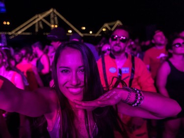 Boucherville native Lea Thai-Savard is a dancing fool at the very front of the Scène Neon on Day 1 of the ÎleSoniq music festival at Île Notre-Dame on Friday Aug. 10, 2018.