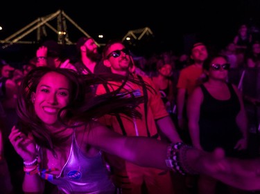 Boucherville native Lea Thai-Savard is a dancing fool at the very front of the Scène Neon on Day 1 of the ÎleSoniq music festival at Île Notre-Dame on Friday Aug. 10, 2018.