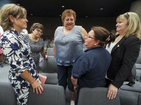 Quebec Justice Minister Stéphanie Vallée, left, meets with mothers Kamelia Vakeflli, left, Nathalie Beaulieu, Marlene Dufresne and Darlene Ryan following press conference at the Palais de Justice in Montreal Tuesday, Aug. 14, 2018.