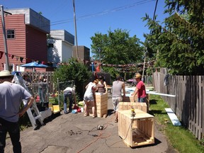 Lachine residents work to beautify one of the borough's alleyways. The borough has launched the Programme de ruelles communautaires which will distribute grants to help residents continue their work. Photo courtesy of Lachine
